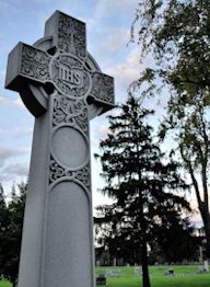cross tomb in graveyard